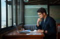 Office worker studying information on a laptop