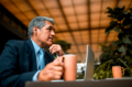 Businessman working on the computer and drinking coffee