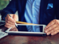 Businessman is working using a tablet